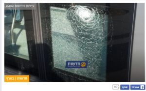 A shattered window in the Jerusalem light rail, from a rock-throwing incident in Shuafat. Photo: Screenshot 