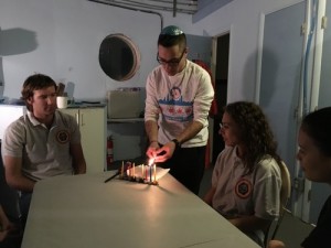 Barak Stoltz lights Hanukkah candles in the Mars Desert Research Station. Photo: Courtesy Barak Stoltz.