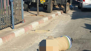 The Palestinian attacker, identified as Muhammad Zahran, after he was shot dead by an Israel security guard. Photo: Hatzalah. 