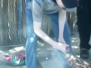 Gilad Schalit, seen in newly released Hamas footage, grilling meat with his captors. Photo: Screenshot.