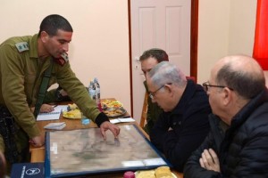 Israeli Prime Minister Benjamin Netanyahu strategizes with defense officials while visiting Otniel. Photo: Amos Ben Gershom/GPO.
