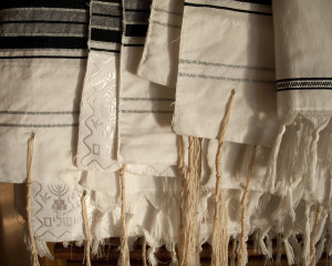 Different styles of a Jewish prayer shawl, also known as talit. A man sported a talit to New York Fashion Week: Men's. Photo: Flickr.