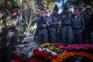 Friends and relatives attend the funeral of slain Israeli Border Police officer Hadar Cohen, 19, at the cemetery in Yehud in central Israel on Feb. 4. Photo: Yonatan Sindel/Flash90.
