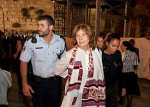 Anat Hoffman being led away by a policeman after a 'Women of the Wall' protest at the Kotel. Photo: Women of the Wall.