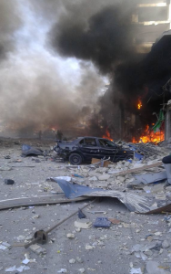 A photo from the scene of the explosion in Syria where a double car bomb  killed 25 people. Photo: Twitter.
