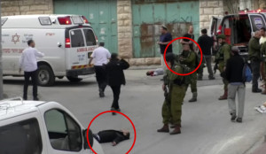 A scene from the B'Tselem video in the immediate aftermath of the Palestinian stabbing attack in Hebron on Thursday. Photo: Screenshot.