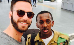 Lone IDF soldier Yitzhak (right) with 'good Samaritan' Samuel Levy. Photo: Channel 2/Facebook.