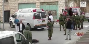 Israeli officials condemned an IDF soldier for an incident shown here in this video screenshot, in which the soldier shot a subdued Palestinian terrorist. Photo: B'Tselem/YouTube/Screenshot.