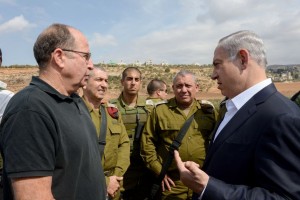 Israeli Prime Minister Benjamin Netanyahu speaks with Minister of Defense Moshe Ya'alon and IDF Chief of Staff Gadi Eizenkott during a visit to the West Bank following recent terror attacks, October 6, 2015. (Photo by Amos Ben Gershom/GPO)