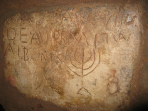 An inscription of a menorah in the Jewish catacombs of Rome, which will be open to the public between May 1 and June 5. Photo: Wikimedia Commons.