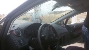 The windshield of the car that was hit by a large rock on Sunday. Photo: Hatzalah Yehuda and Shomron.