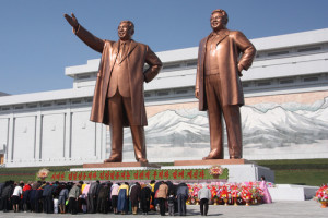 North Koreans bow to statues of former leaders Kim Il-sung and Kim Jong-il in the capital of Pyongyang. Photo: J.A. de Roo via Wikimedia Commons.