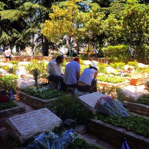 A family remembering loved ones at Mount Herzl cemetery in Jerusalem. Israel held its annual state memorial service for victims of terror at the cemetery. Photo: Wikimedia Commons.