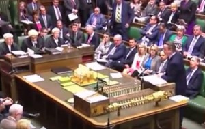 Prime Minister David Cameron, standing. Photo: Video Screenshot.