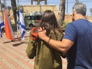 Yesh Atid Party chairman Yair Lapid, with his daughter, Yael, at her IDF graduation ceremony. Photo: Facebook.