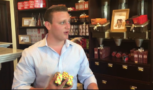 Dovi Meyer buying chocolate inside the Max Brenner store that was the site of Wednesday's terror attack. Photo: Screenshot.