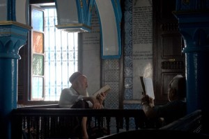 The Jewish community in Djerba is dwindling in number as more of its members flee to Israel in large numbers of safety concerns. Seen here, two Tunisian Jews study in the Ghriba synagogue. Photo: Wikimedia Commons. 
