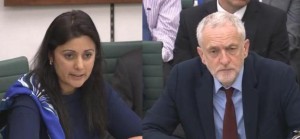 Tory MP Nusrat Ghani (L) questions Labour head Jeremy Corbyn (R) during a parliamentary hearing on Labour's antisemitism report. 