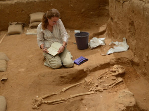 A member of the physical anthropology team examines a 10th-9th century BC burial during the excavation of the Philistine cemetery by the Leon Levy Expedition to Ashkelon. Photo: Melissa Aja/Leon Levy Expedition.