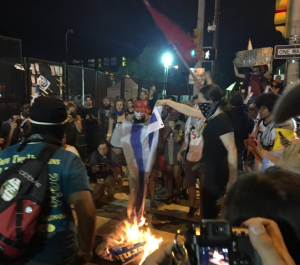 Hillary Clinton condemned the burning of the Israeli flag by protesters outside the Democratic National Convention, shown here. Photo: Byron Tau/Twitter.