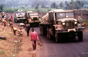 A convoy brings fresh water to Rwandan refugees located at Camp Kimbumba, Zaire i August, 1994. Credit:  TSgt. Marc Krause via Wikimedia Commons. 