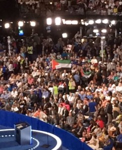 Palestinian activists hold up the Palestinian flag on the first day of the Democratic National Convention. Absent are American flags. Photo. Twitter. 