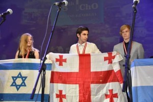 A member of the Israeli team holds up her country's flag at the closing ceremony of the International Chemistry Olympiad in Tbilisi, Georgia. Photo: Facebook.