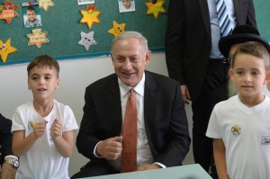 Israeli Prime Minister Benjamin Netanyahu congratulating Arab-Israeli first-graders on the start of the school year. Photo: Facebook.