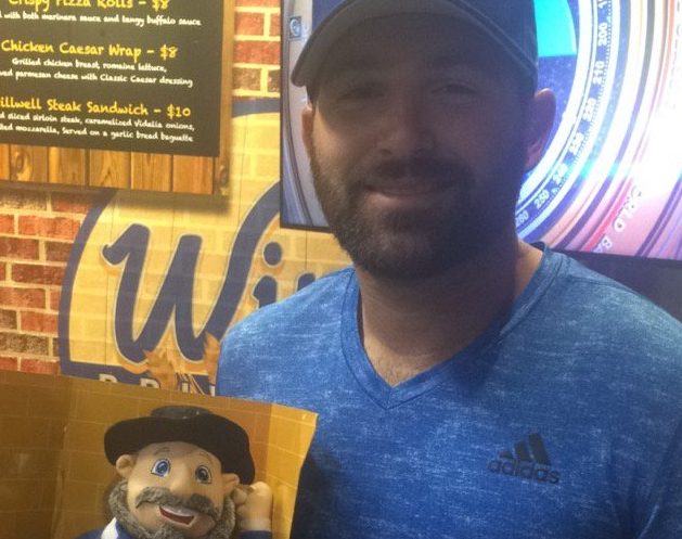 Cody Decker with his 'Mensch on a Bench.' Photo: Twitter.