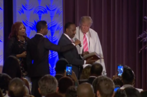 Donald Trump wearing a Jewish prayer shawl at a Detroit church. Photo: Screenshot. 