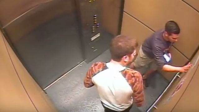 Two Santa Clara University students seen vandalizing a down elevator with a "blood swastika." Photo: Video Screenshot. 