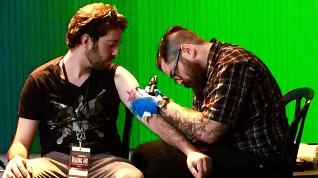 An Israeli receiving a free tattoo as part of the Healing Ink Israel project. Photo: Courtesy.