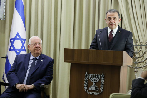 Israeli President Reuven Rivlin (left) looks on as incoming Turkish Ambassador to Israel Kemal Okem speaks during a ceremony for new ambassadors at the President's Residence in Jerusalem Dec. 12, 2016. Photo: Isaac Harari/Flash90.