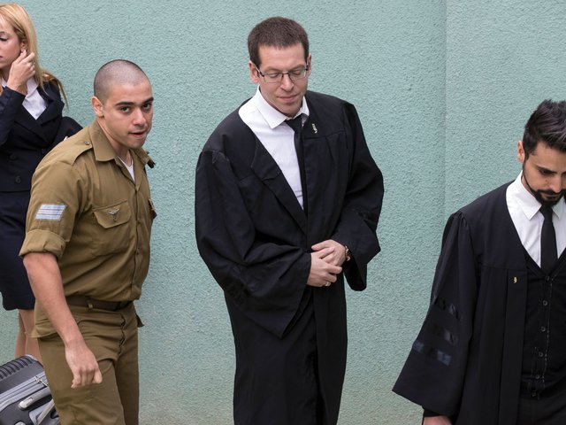 Sgt. Elor Azaria, left. Photo: AmnestyUK.