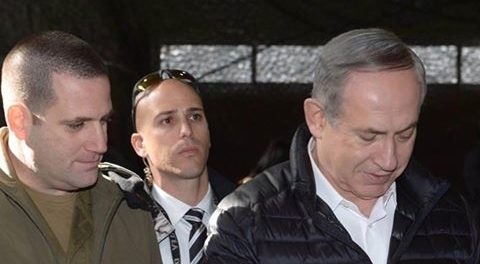 Israeli PM Benjamin Netanyahu inspects a seized Palestinian weapon during a tour of the IDF's West Bank headquarters on Tuesday. Photo: Amos Ben Gershom / GPO via Netanyahu's Facebook page.