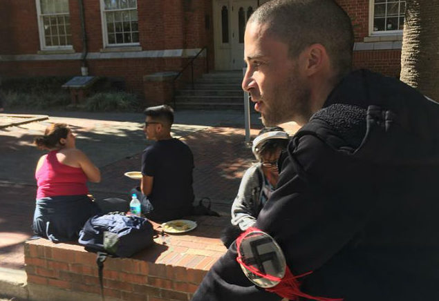 A man wearing a Nazi armband seen riding his bicycle on the University of Florida campus. Photo: Shane Bartley/ Facebook. 
